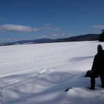 Elaine looks across Rangeley Lake to Saddleback Mountain.