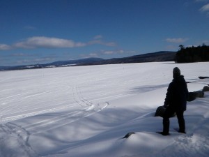 Elaine looks across Rangeley Lake to Saddleback Mountain.